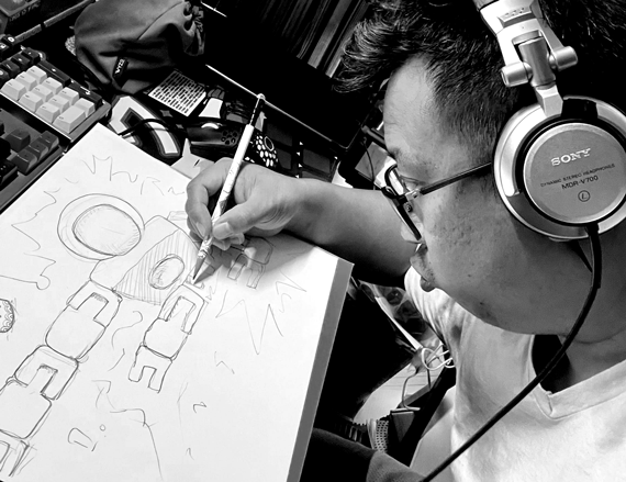 Kwamatics, Brian Kwa, drawing at his workstation